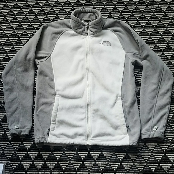 white and gray north face jacket
